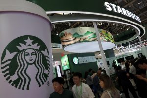 People visit the Starbucks booth during the China International Supply Chain Expo in Beijing, China July 16, 2025. REUTERS/Florence Lo