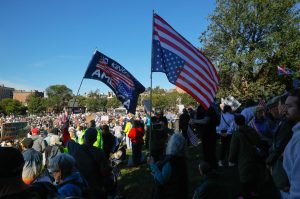 People wave flags during a "No Kings" protest against U.S. President Donald Trump's policies in Boston, Massachusetts, U.S., October 18, 2025. REUTERS/Brian Snyder