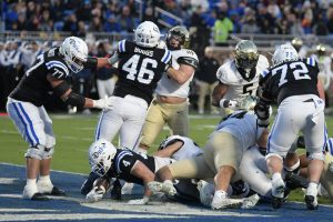 Nov 29, 2025; Durham, North Carolina, USA; Duke Blue Devils running back Anderson Castle (4) scores a touchdown against the Wake Forest Demon Deacons during the second quarter at Wallace Wade Stadium. Mandatory Credit: Zachary Taft-Imagn Images