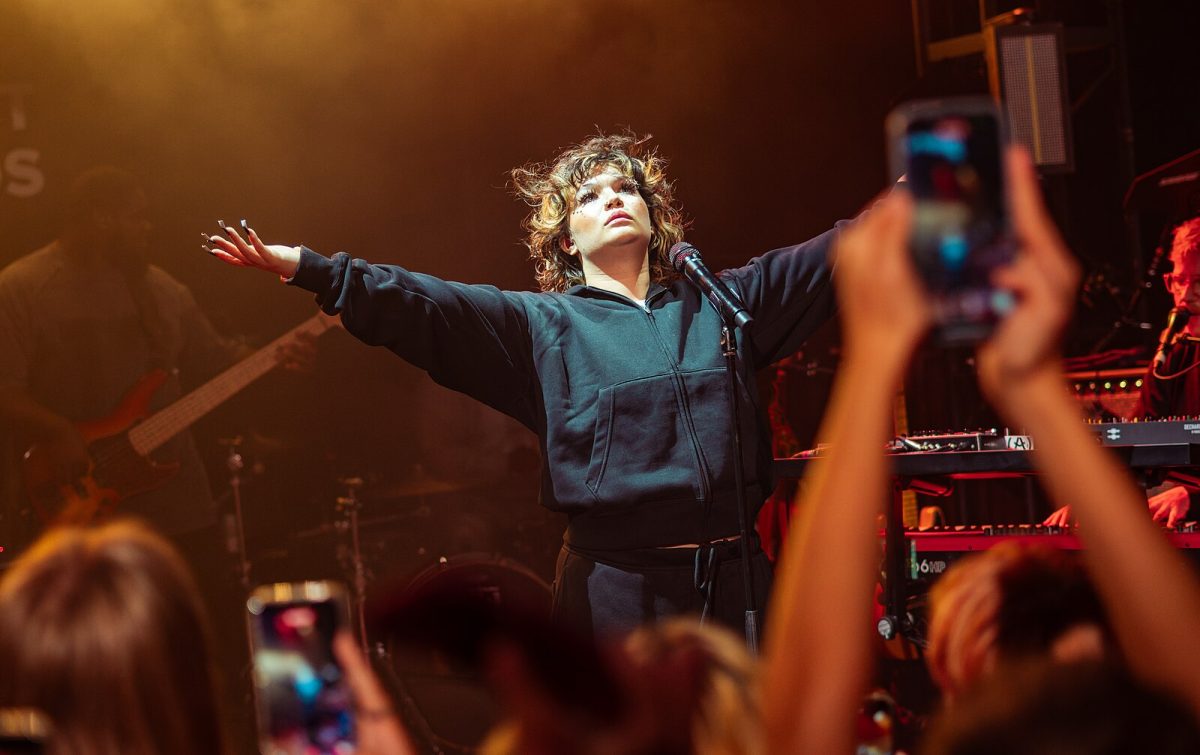 Lola Young performing in September 2025, CC BY 4.0, via Wikimedia Commons 