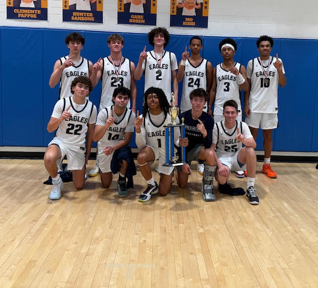PCDS Boys' Basketball Team Poses with Trophy