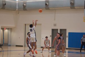 Senior JD Jones shooting a three-pointer