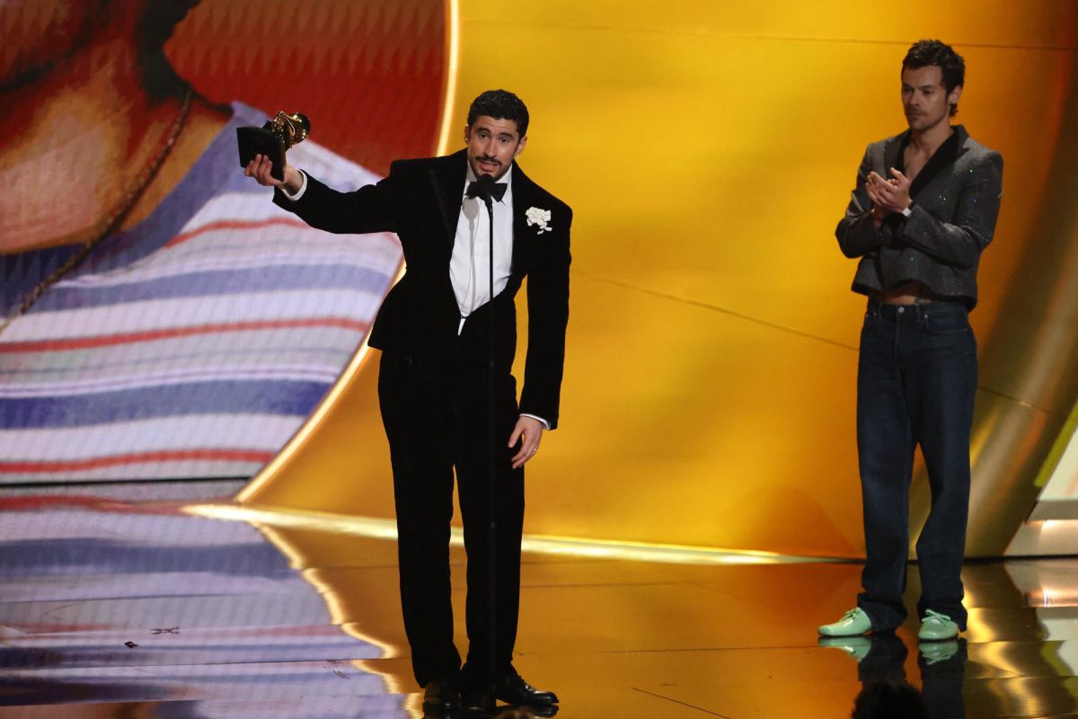 Bad Bunny accepts the award for Album of the Year for "Debi Tirar Mas Fotos" as presenter Harry Styles looks on during the 68th Annual Grammy Awards in Los Angeles, California, U.S., February 1, 2026. REUTERS/Daniel Cole