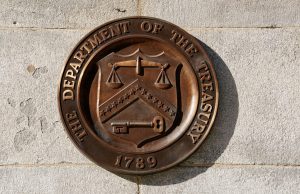 A bronze seal for the Department of the Treasury is shown at the U.S. Treasury building in Washington, U.S., January 20, 2023. REUTERS/Kevin Lamarque