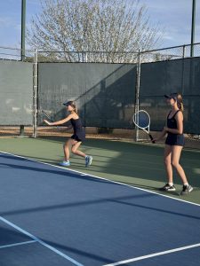 Ali Leinbach (left) and Ann Nichols (right) play doubles